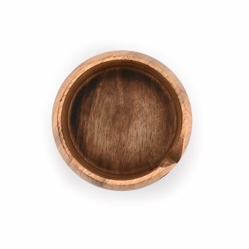 Top view of an empty wooden bowl.